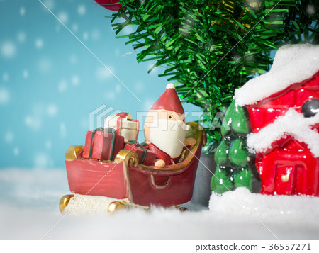 Happy Santa Claus with gifts box on the snow sled 36557271