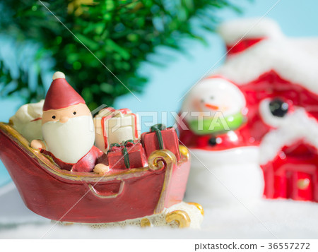 Happy Santa Claus with gifts box on the snow sled Happy Santa Claus with gifts box on the snow sled 36557272