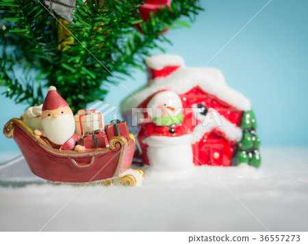 Happy Santa Claus with gifts box on the snow sled Happy Santa Claus with gifts box on the snow sled 36557273