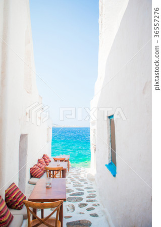 Benches with pillows in a typical greek outdoor 36557276
