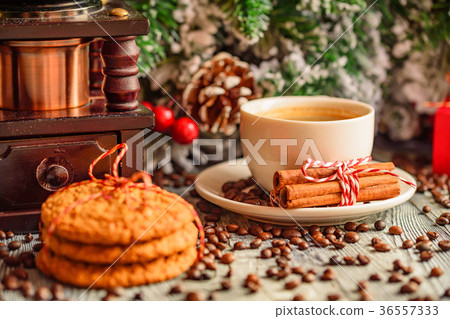 Cozy winter setting with cup of coffee Cozy winter setting with cup of coffee 36557333