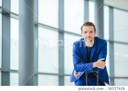 Portrait of young man in airport. Casual young boy Portrait of young man in airport. Casual young boy 36557426