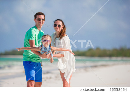 Young family on beach vacation. Family of three Young family on beach vacation. Family of three 36558464