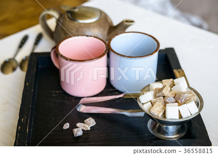 Teaset with two metal cups, sugar tongs and kettle Teaset with two metal cups, sugar tongs and kettle 36558815