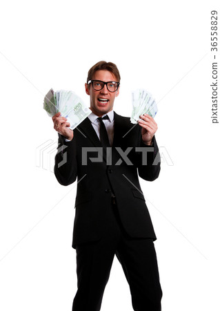 Picture of businessman in suit with money at hands Picture of businessman in suit with money at hands 36558829