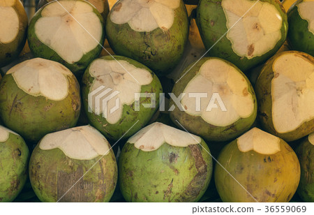 Closeup of fresh Coconut on the table on market Closeup of fresh Coconut on the table on market 36559069
