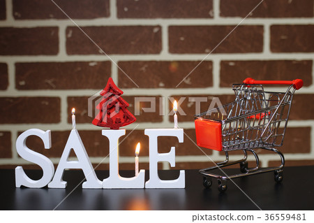 Trolley for products on a brick wall background 36559481