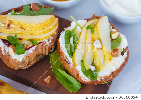 Sandwiches with cottage cheese, honey, pear Sandwiches with cottage cheese, honey, pear 36560054