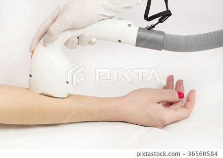 The process of laser depilation of female limbs in The process of laser depilation of female limbs in 36560584