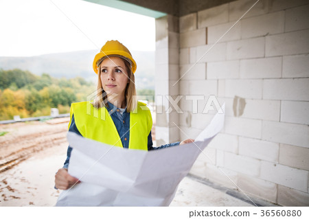 Young woman worker on the building site. 36560880