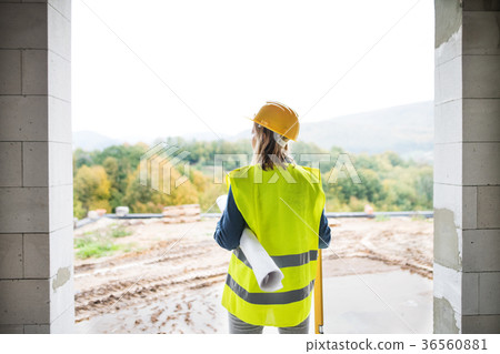 Young woman worker on the building site. 36560881