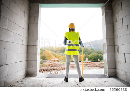 Young woman worker on the building site. 36560888