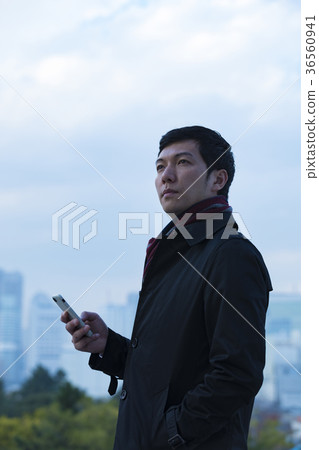 A businessman wearing a coat A businessman wearing a coat 36560941