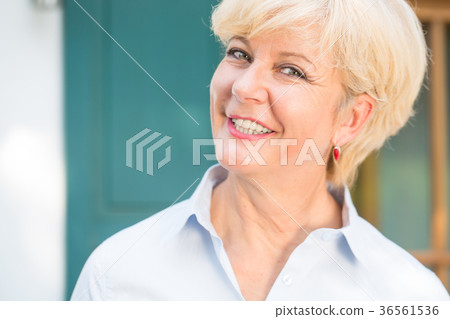 Close-up portrait of a cheerful senior woman with Close-up portrait of a cheerful senior woman with 36561536
