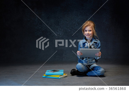 Little girl sitting with tablet Little girl sitting with tablet 36561868