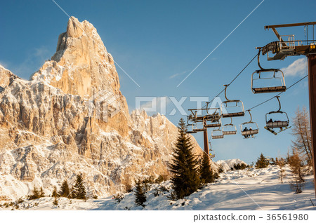chair lifts with snow-capped dolomites background chair lifts with snow-capped dolomites background 36561980