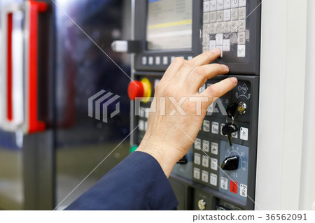 operator working with CNC machining center 36562091