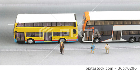 small figure at road with tiny bus small figure at road with tiny bus 36570290