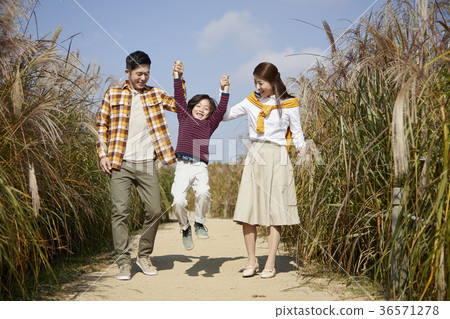 Dad, mom, son, park, autumn 36571278