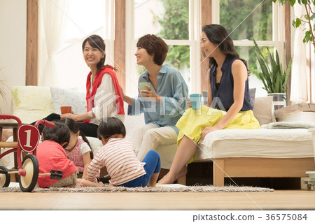 Mom friends relaxing in the living room 36575084