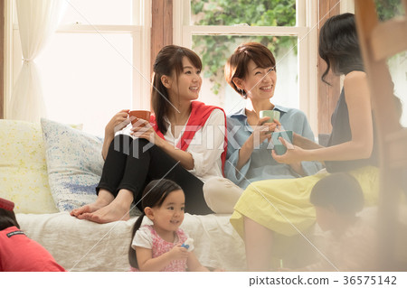 Mom friends relaxing in the living room 36575142