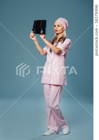 beautiful female doctor holding a scan 36576996