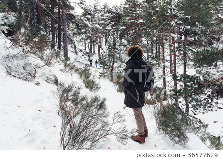 Woman standing in snowed mountain 36577629