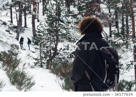Woman standing in snowed mountain 36577634