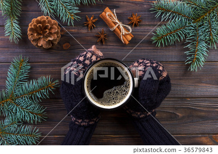 Woman hands holding coffee mug 36579843