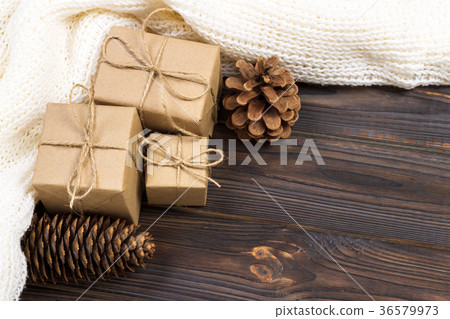 Christmas gifts and white scarf on a black wooden 36579973