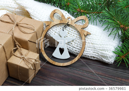 Wrapped Christmas gifts with white angel Wrapped Christmas gifts with white angel 36579981