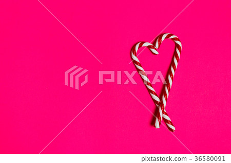 christmas candy heart on pink background 36580091