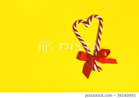 Two Christmas candy canes overlapping Two Christmas candy canes overlapping 36580093