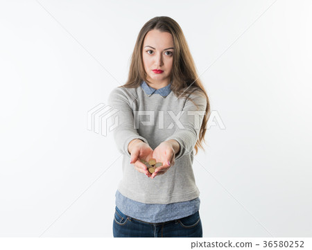 Woman hands holding euro coins and giving them to 36580252