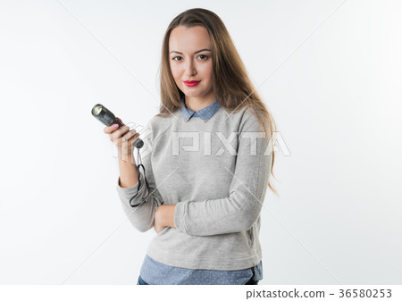 Woman holding an electrical torch flashlight Woman holding an electrical torch flashlight 36580253