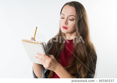 young caucasian pretty girl with sketchbook and 36580337