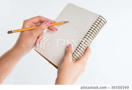 closeup view of hands with sketchbook and pencil 36580349