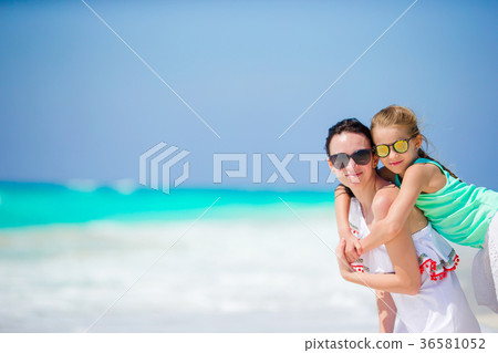 Little adorable girl and young mother at tropical 36581052