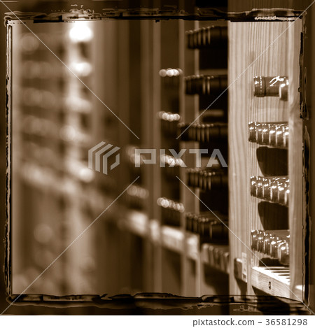 Wine bottles on wooden shelf in store 36581298