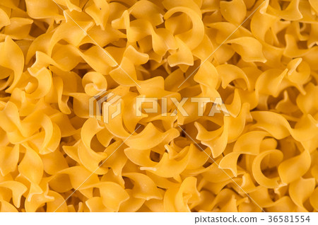Full background of dry uncooked pasta Full background of dry uncooked pasta 36581554