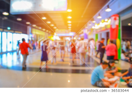 blurred people walking in shopping center blurred people walking in shopping center 36583044