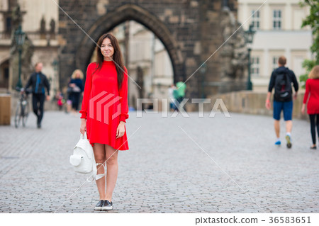 Happy young urban woman in european city on the Happy young urban woman in european city on the 36583651