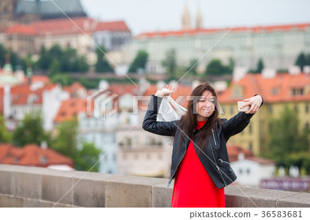 Happy young urban woman in european city on the 36583681