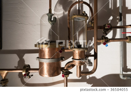 Copper still alembic inside distillery Copper still alembic inside distillery 36584055