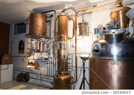 Copper still alembic inside distillery 36584057