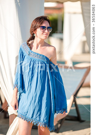 Young woman on the beach. Fashion girl in white Young woman on the beach. Fashion girl in white 36584863