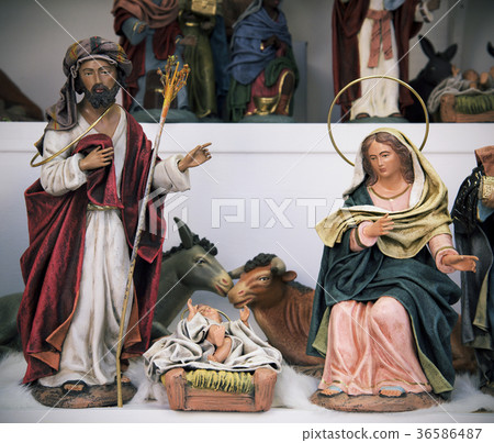 the holy family on sale in a Christmas market 36586487