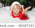 happy girl in santa costume on snow 36587191