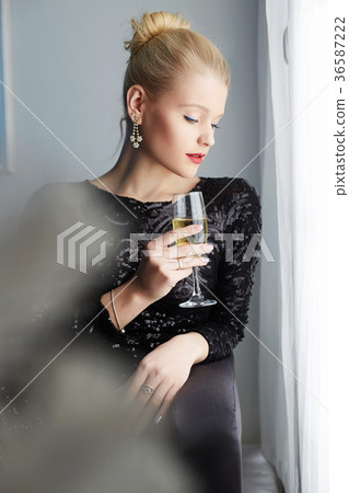 woman with champagne.winter home lifestyle woman with champagne.winter home lifestyle 36587222