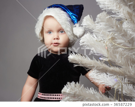 funny santa child girl with christmas tree 36587229